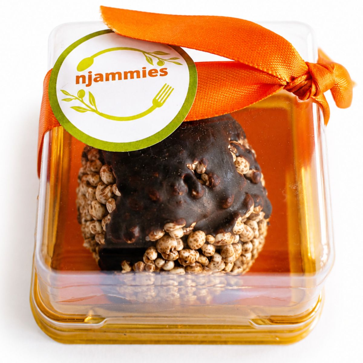 Njammies Millet Moon Balls in a clear dome pack showing puffed millet and homemade chocolate.