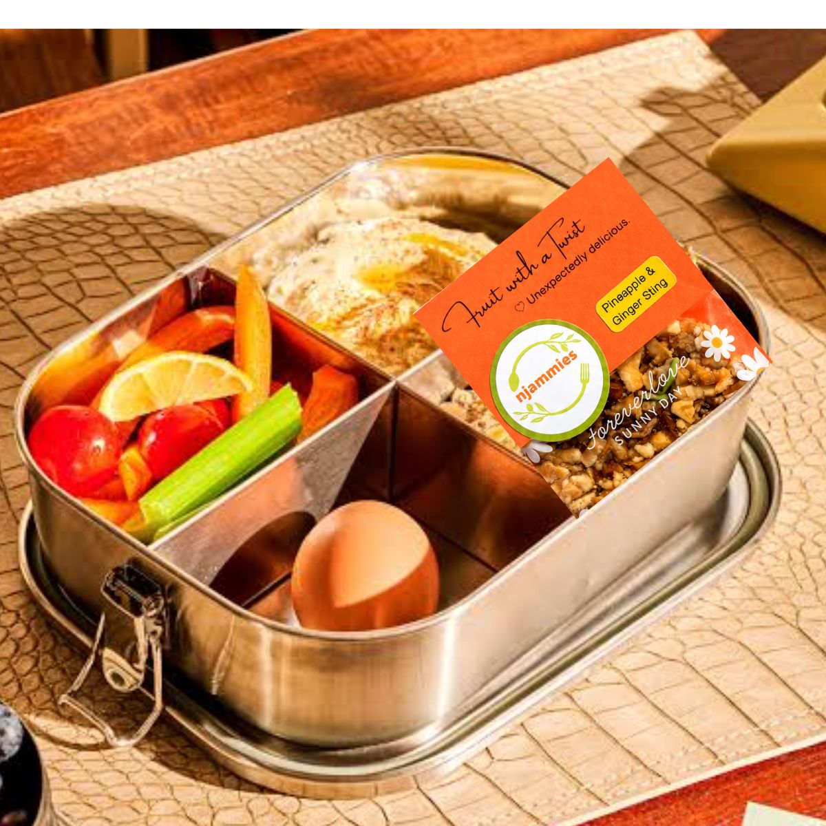 Njammies Fruit With A Twist packed in a lunchbox with colourful snacks.