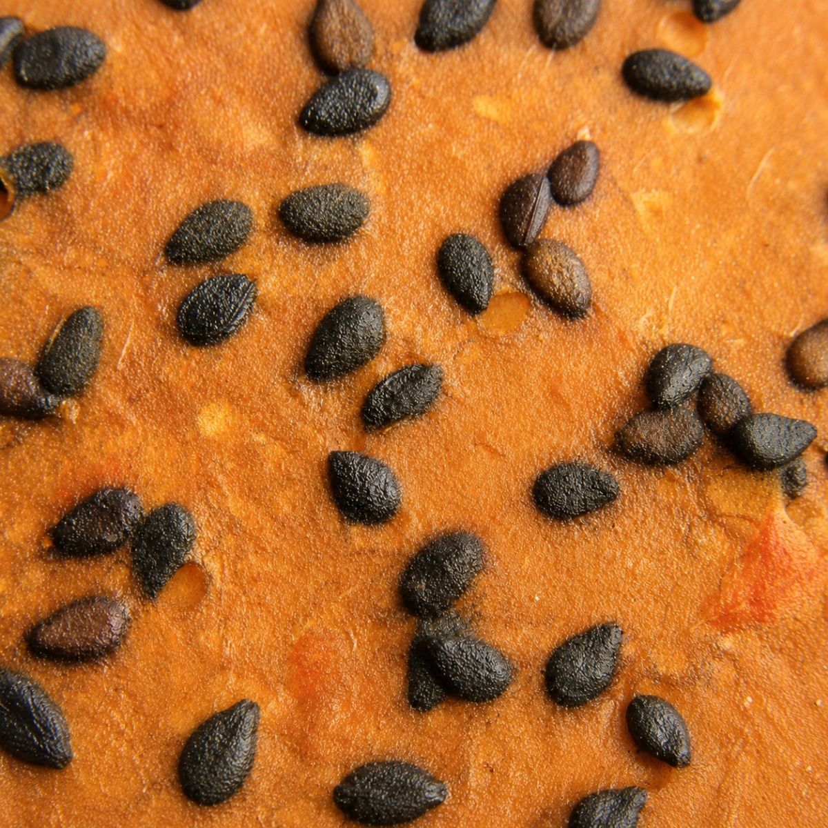 Close-up of Njammies Sweet Potato Shards with black sesame seeds baked into the shards