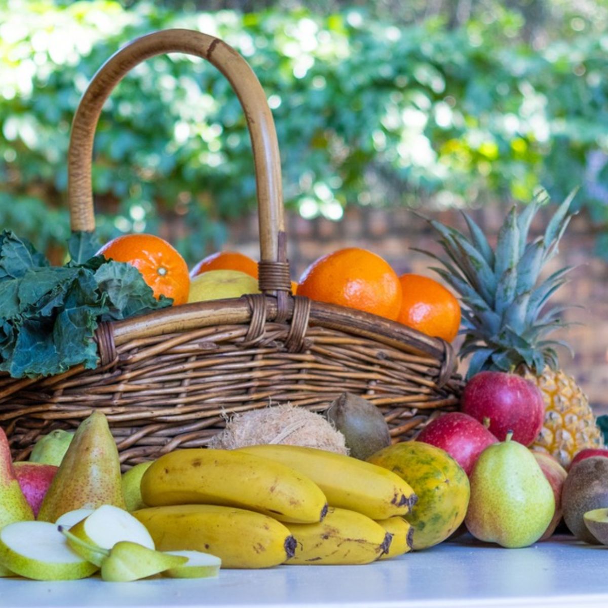 Basket of colourful fresh seasonal fruit representing the changing varieties used in Njammies Fruit Medley.