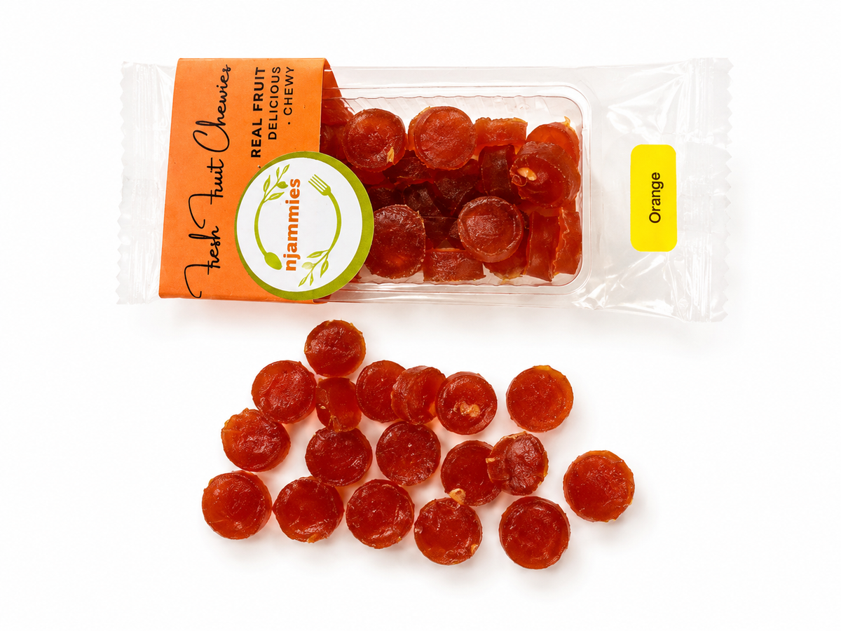Njammies Orange Fresh Fruit Chewies in a clear container.
